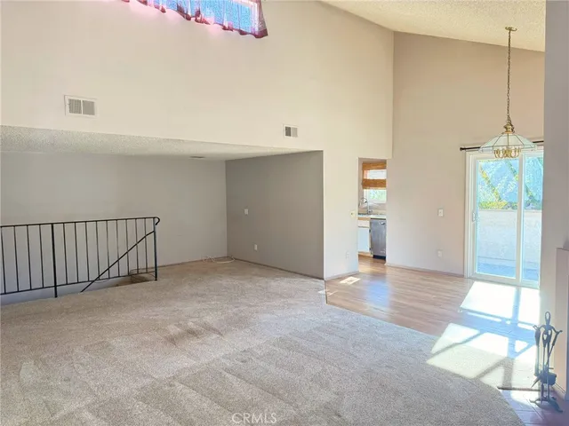 a view of an empty room with a fireplace
