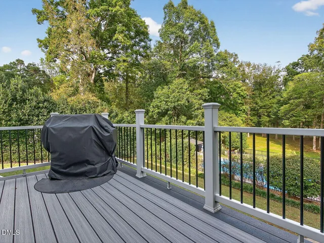 a view of balcony with wooden floor