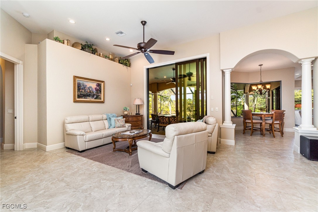 6135 Calusa Rdg Trail Bokeelia, FL 33922 - Photo 14 of 46 a living room with furniture and a large window