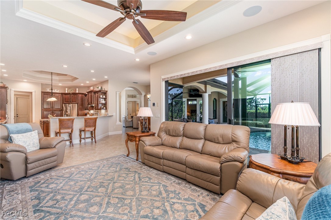 6135 Calusa Rdg Trail Bokeelia, FL 33922 - Photo 16 of 46 a living room with furniture and a large window