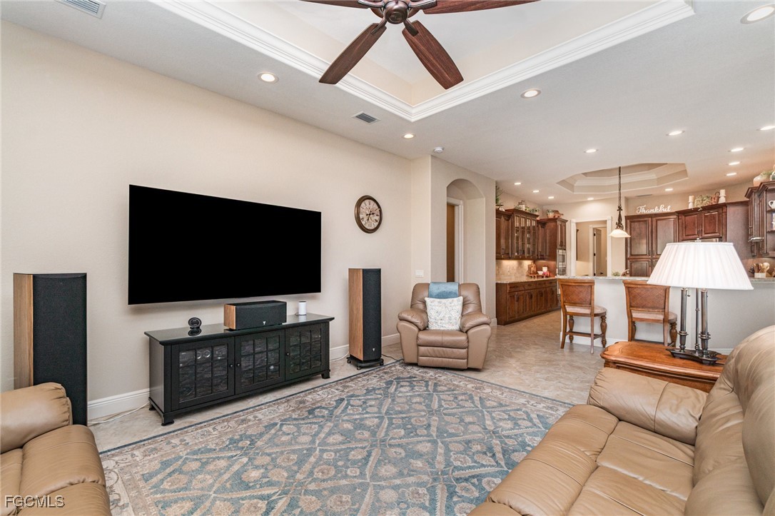 6135 Calusa Rdg Trail Bokeelia, FL 33922 - Photo 17 of 46 a living room with furniture and a flat screen tv