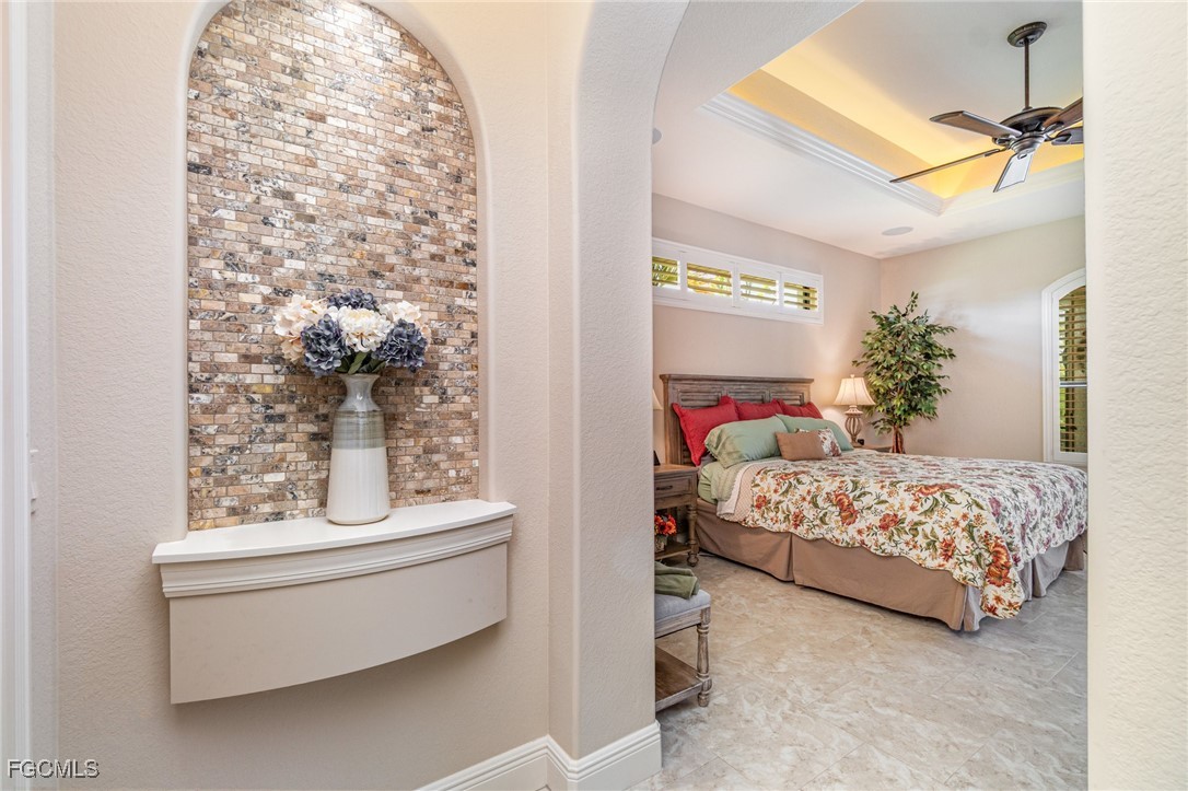 6135 Calusa Rdg Trail Bokeelia, FL 33922 - Photo 19 of 46 a bedroom with a bed and a window