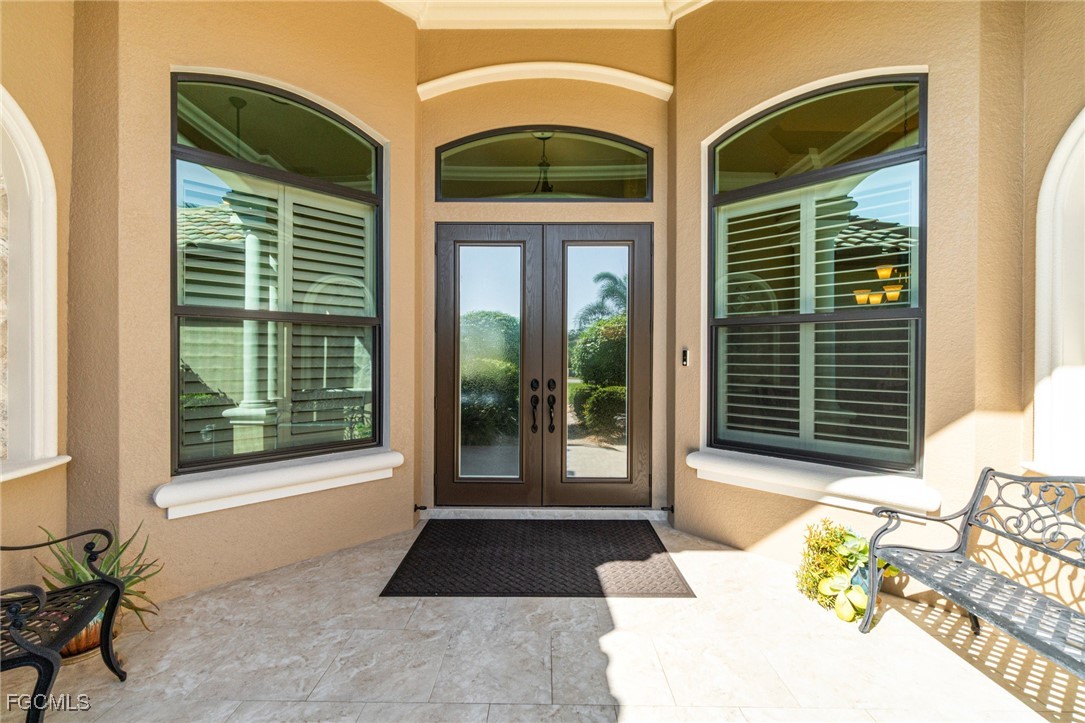 6135 Calusa Rdg Trail Bokeelia, FL 33922 - Photo 2 of 46 a front view of a house with a large window