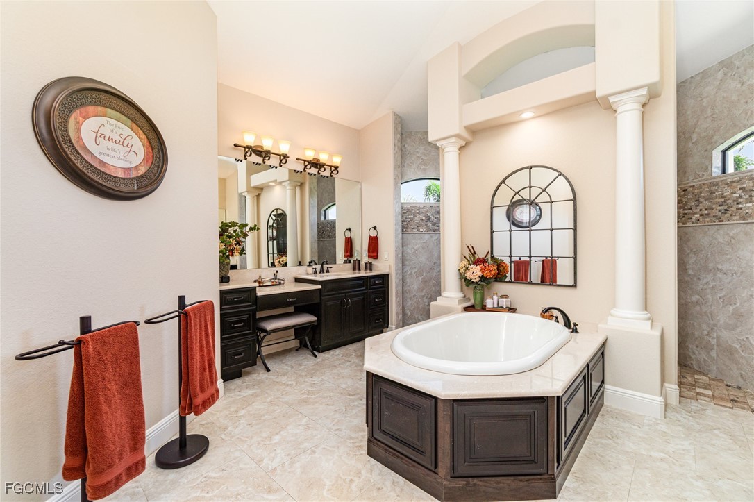 6135 Calusa Rdg Trail Bokeelia, FL 33922 - Photo 22 of 46 a bathroom with a sink and a mirror