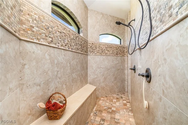a bathroom with a bathtub and shower