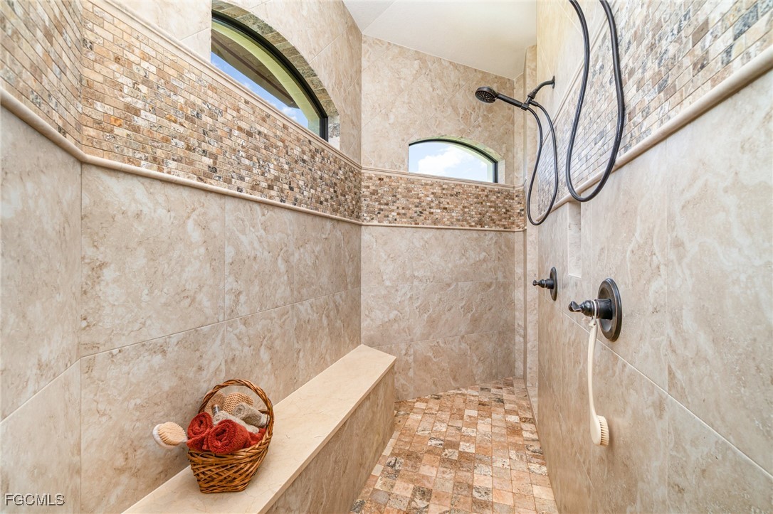 6135 Calusa Rdg Trail Bokeelia, FL 33922 - Photo 24 of 46 a bathroom with a bathtub and shower