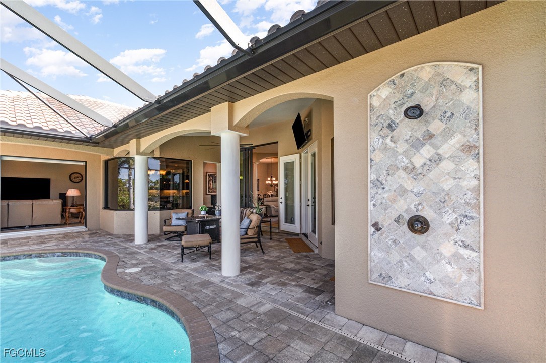 6135 Calusa Rdg Trail Bokeelia, FL 33922 - Photo 33 of 46 a view of a hallway with dining area and glass door