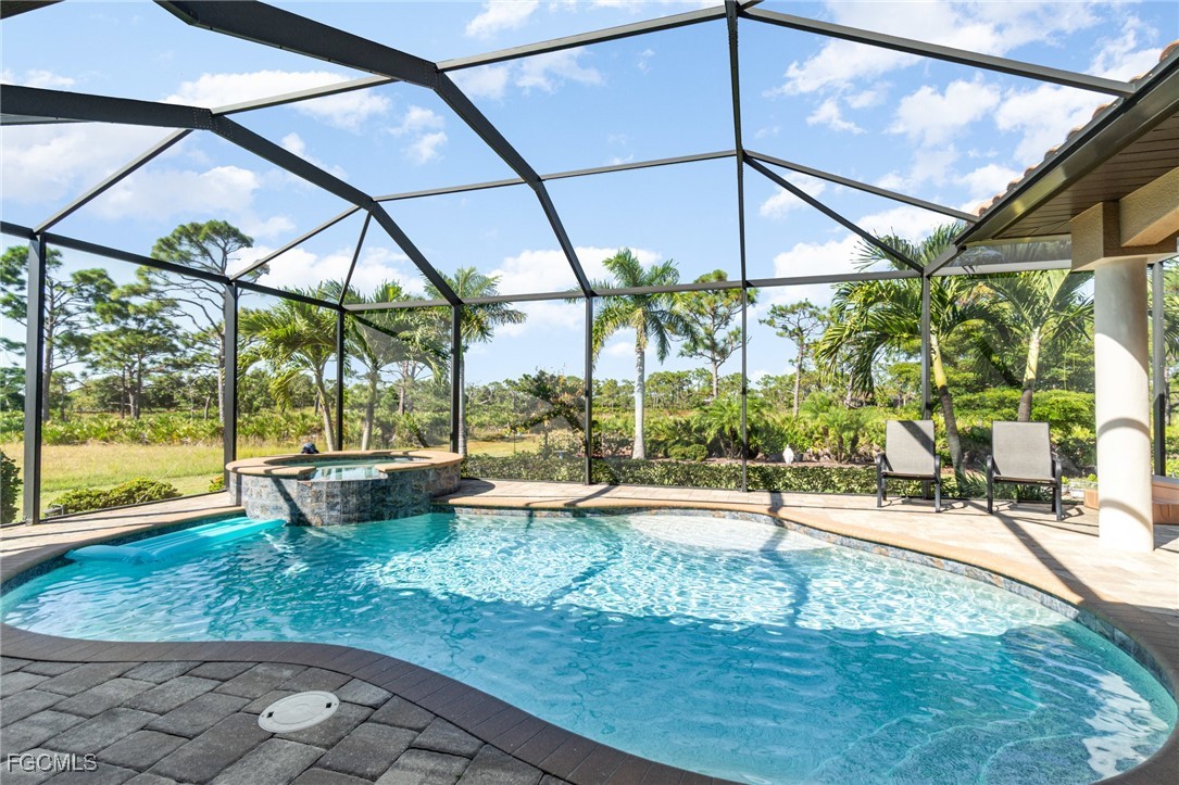 6135 Calusa Rdg Trail Bokeelia, FL 33922 - Photo 4 of 46 a view of a swimming pool with a patio
