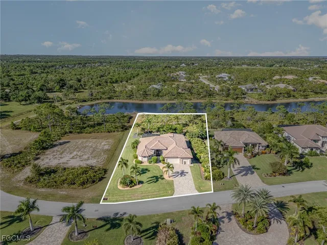 an aerial view of a residential houses with outdoor space