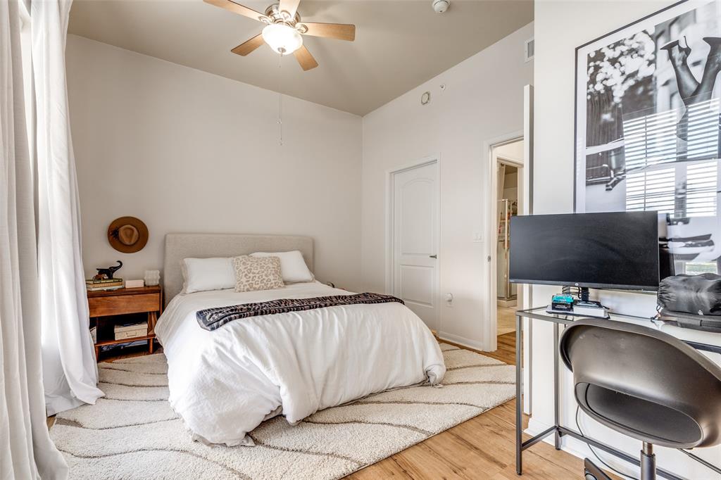 3225 Turtle Creek, Unit 719 Dallas, TX 75219 - Photo 17 of 24 a bedroom with a bed and a chair