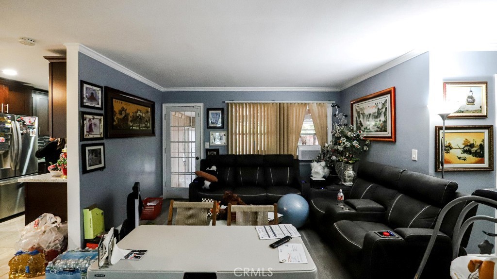 11821 Easy Way Garden Grove, CA 92840 - Photo 11 of 48 a living room with furniture and a window