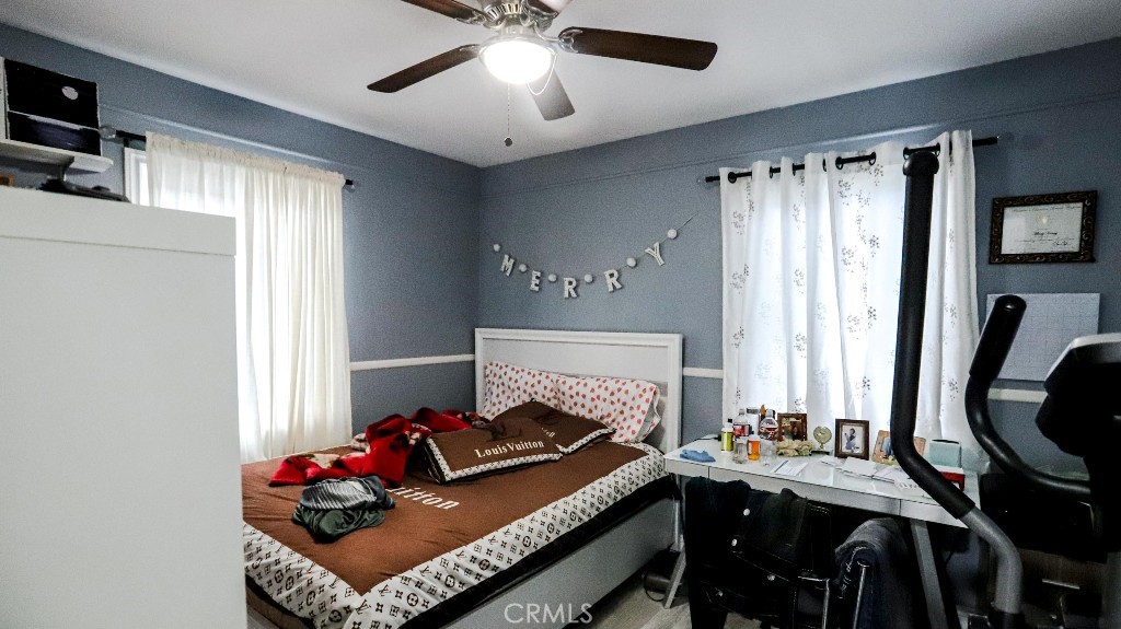 11821 Easy Way Garden Grove, CA 92840 - Photo 23 of 48 a bed room with furniture and a fireplace