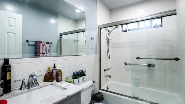 a bathroom with a bathtub and a sink