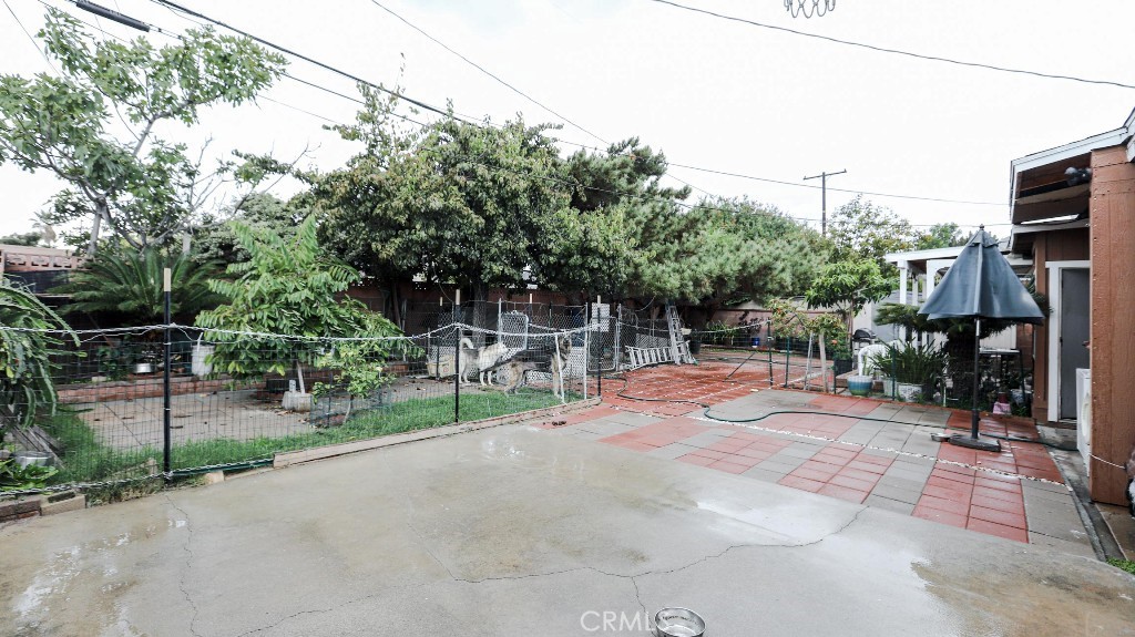 11821 Easy Way Garden Grove, CA 92840 - Photo 30 of 48 a view of backyard with wheel chair potted plants and large tree