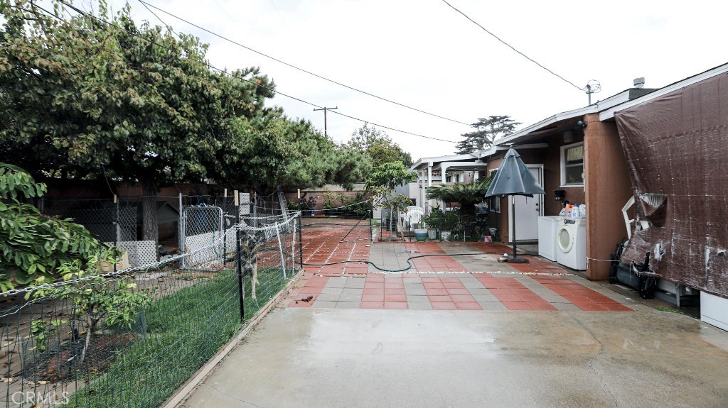 11821 Easy Way Garden Grove, CA 92840 - Photo 31 of 48 a view of a chair and table in backyard