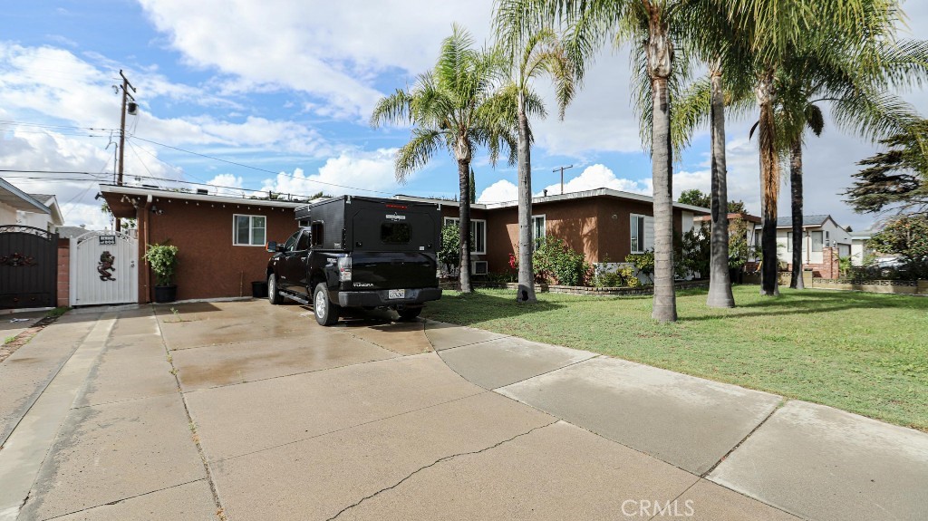 11821 Easy Way Garden Grove, CA 92840 - Photo 4 of 48 a view of a house with a patio