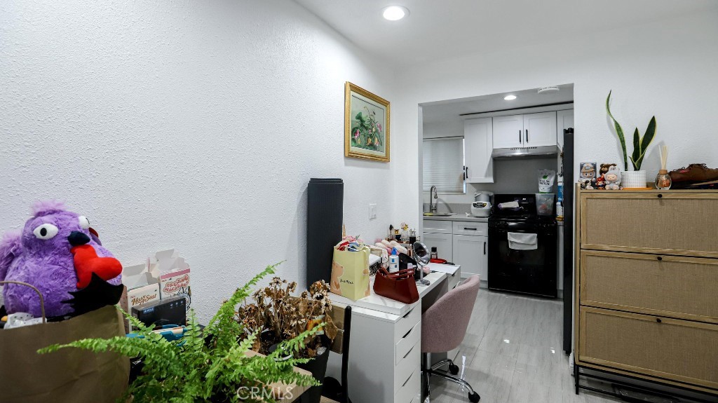 11821 Easy Way Garden Grove, CA 92840 - Photo 41 of 48 a kitchen with a refrigerator and a stove