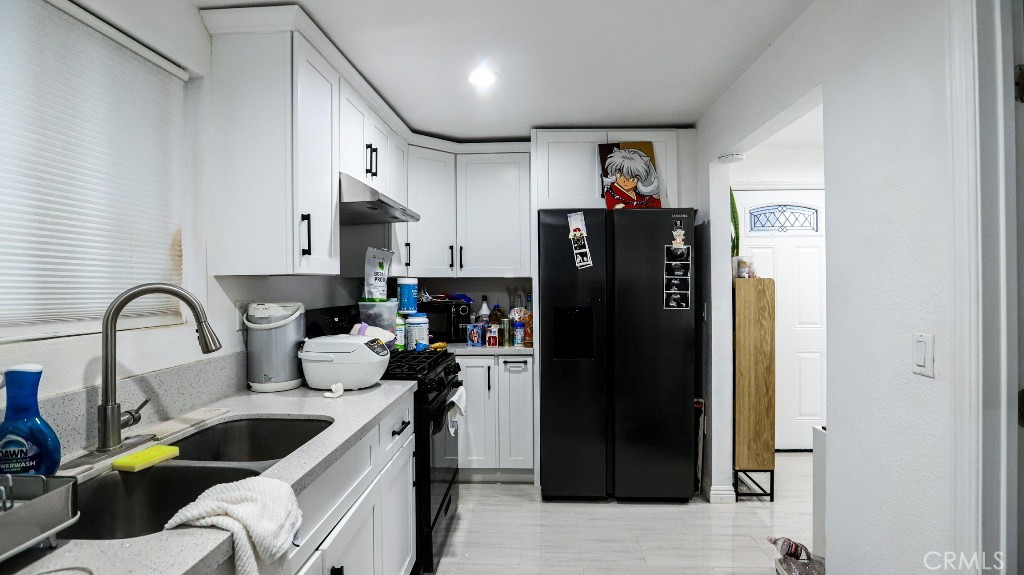 11821 Easy Way Garden Grove, CA 92840 - Photo 44 of 48 a view of living room with furniture and refrigerator