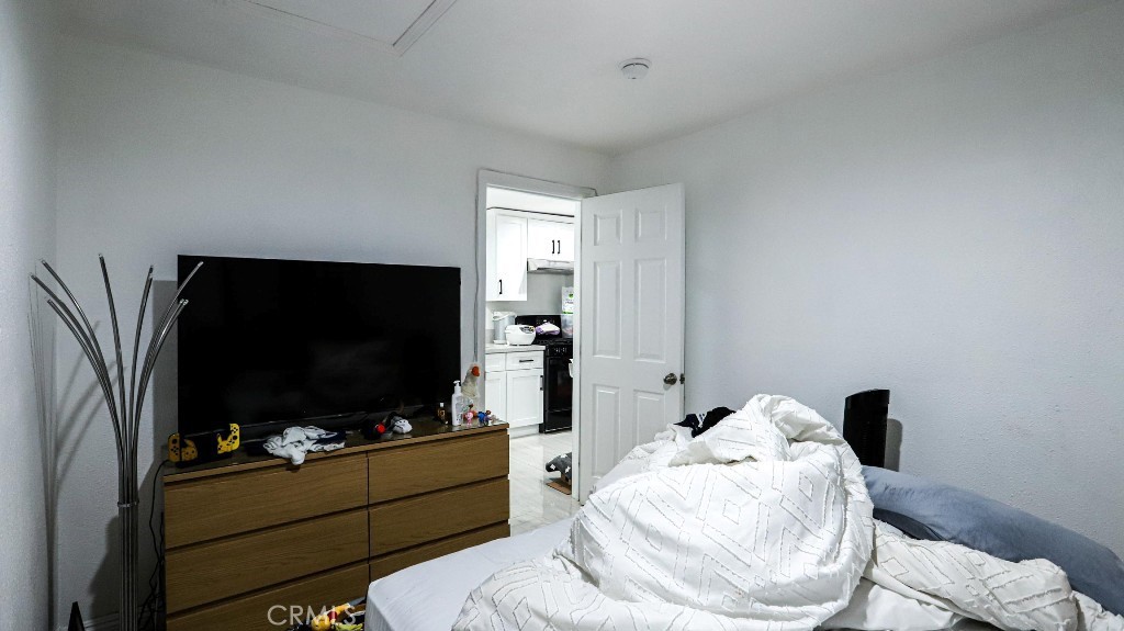 11821 Easy Way Garden Grove, CA 92840 - Photo 47 of 48 a living room with furniture and a flat screen tv
