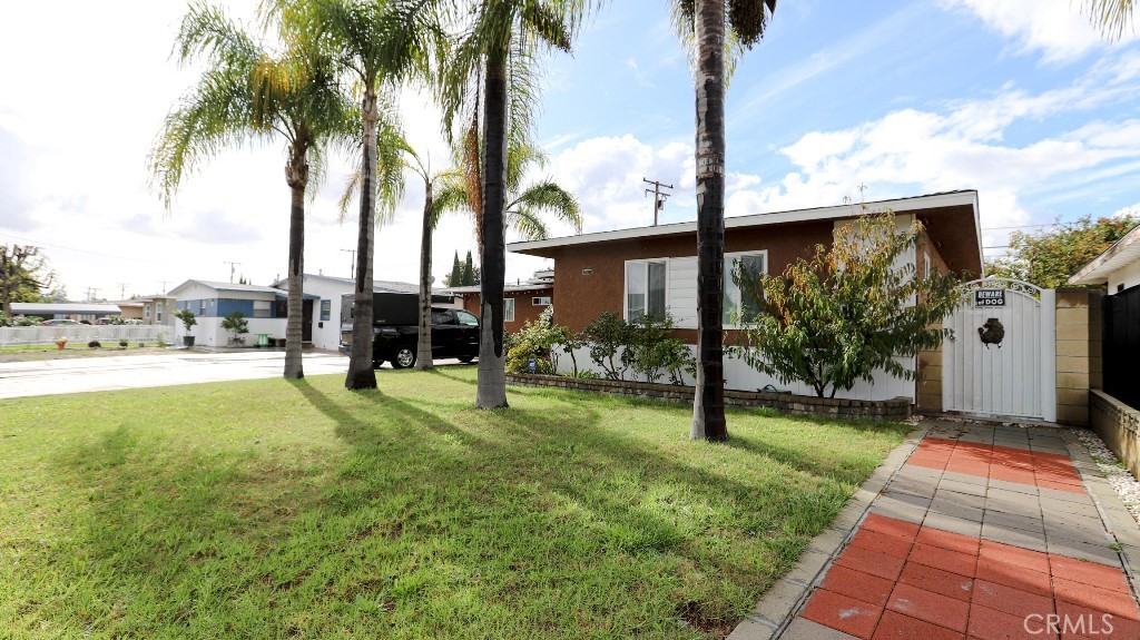 11821 Easy Way Garden Grove, CA 92840 - Photo 5 of 48 a view of a garden with a tree