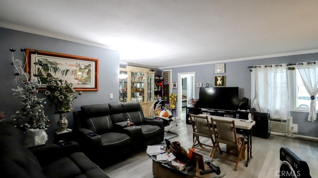 11821 Easy Way Garden Grove, CA 92840 - Photo 8 of 48 a living room with furniture and a flat screen tv