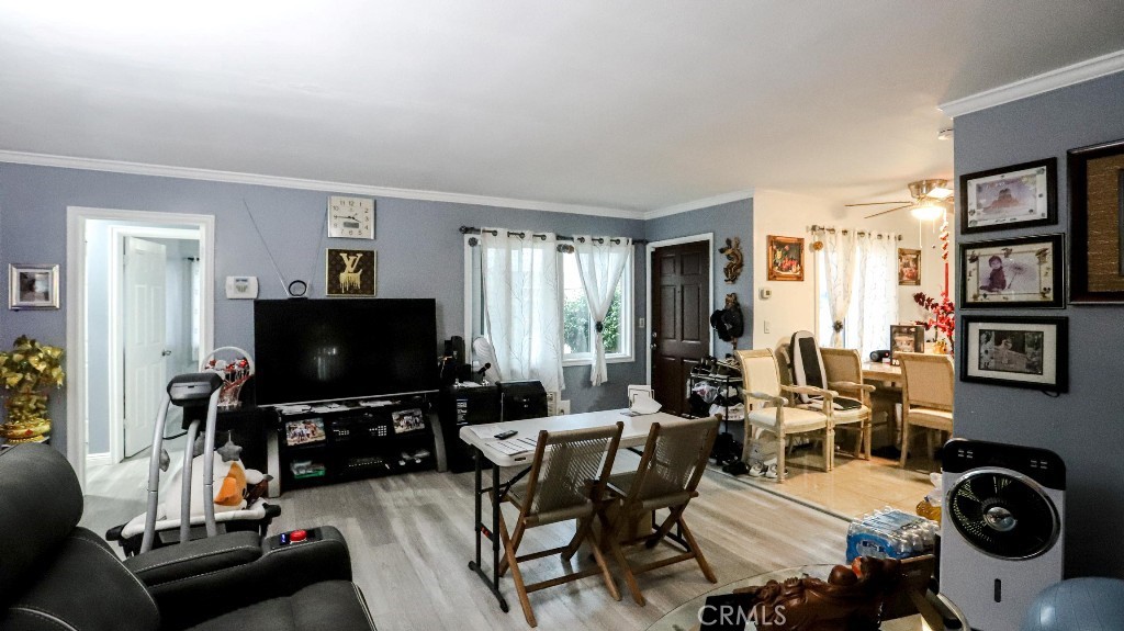 11821 Easy Way Garden Grove, CA 92840 - Photo 9 of 48 a living room with furniture and a flat screen tv
