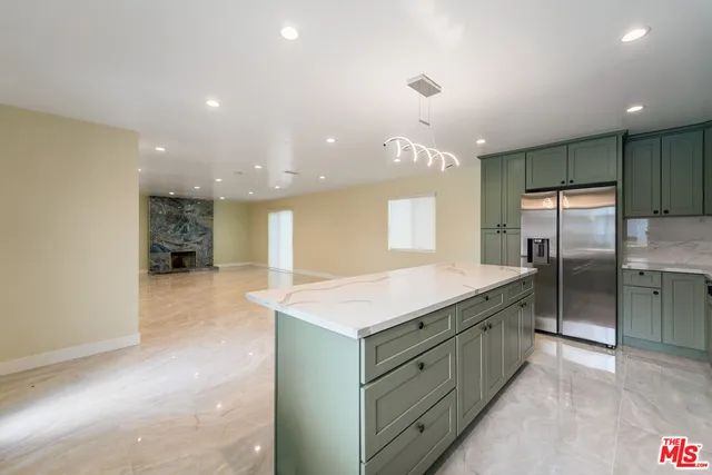 a bathroom with a granite countertop sink a large mirror and a shower