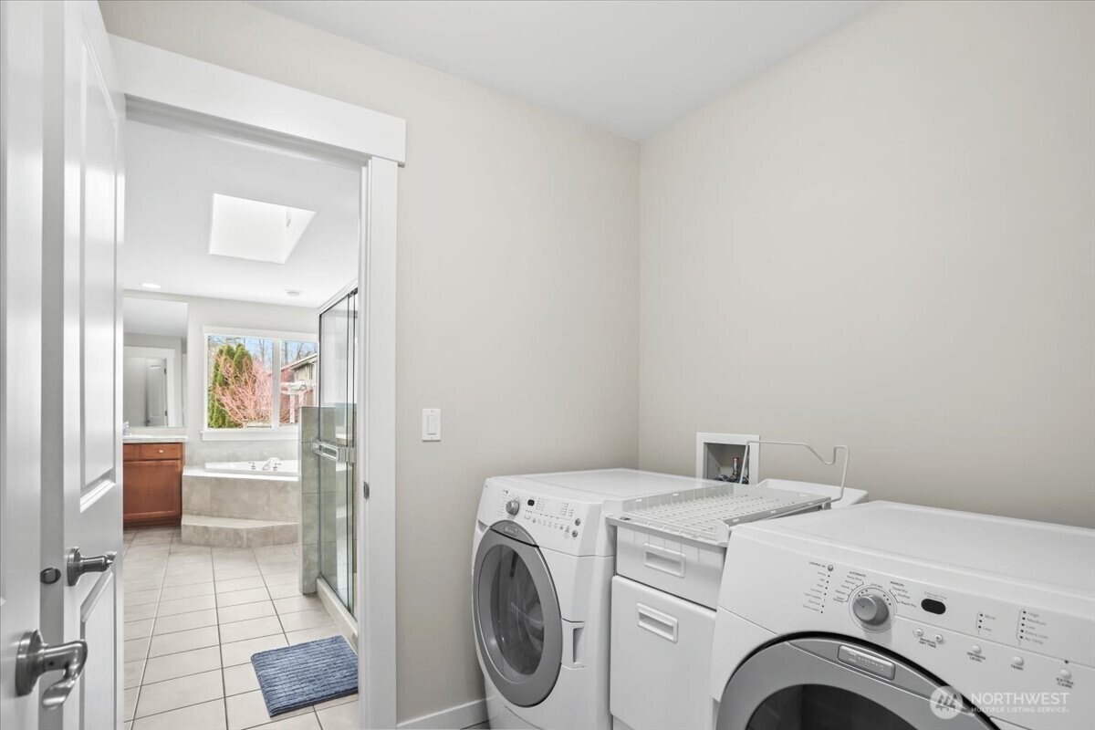 901 Jericho Place Northeast Renton, WA 98059 - Photo 17 of 38 a view of storage and utility room with washer and dryer