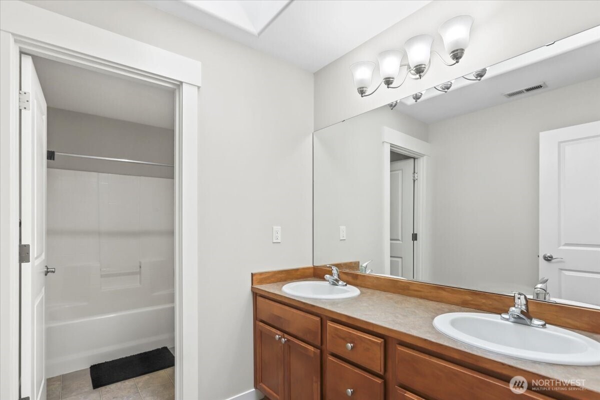 901 Jericho Place Northeast Renton, WA 98059 - Photo 20 of 38 a bathroom with a sink double vanity and a mirror