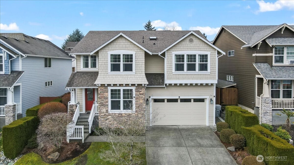 901 Jericho Place Northeast Renton, WA 98059 - Photo 2 of 38 a front view of a house with a yard