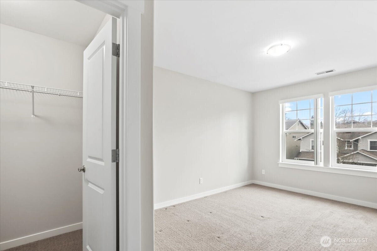 901 Jericho Place Northeast Renton, WA 98059 - Photo 21 of 38 a view of an empty room with a window
