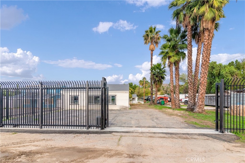 19620 Temescal Canyon Road Corona, CA 92881 - Photo 1 of 20 Entrance with Guardian fencing and electric opener.
