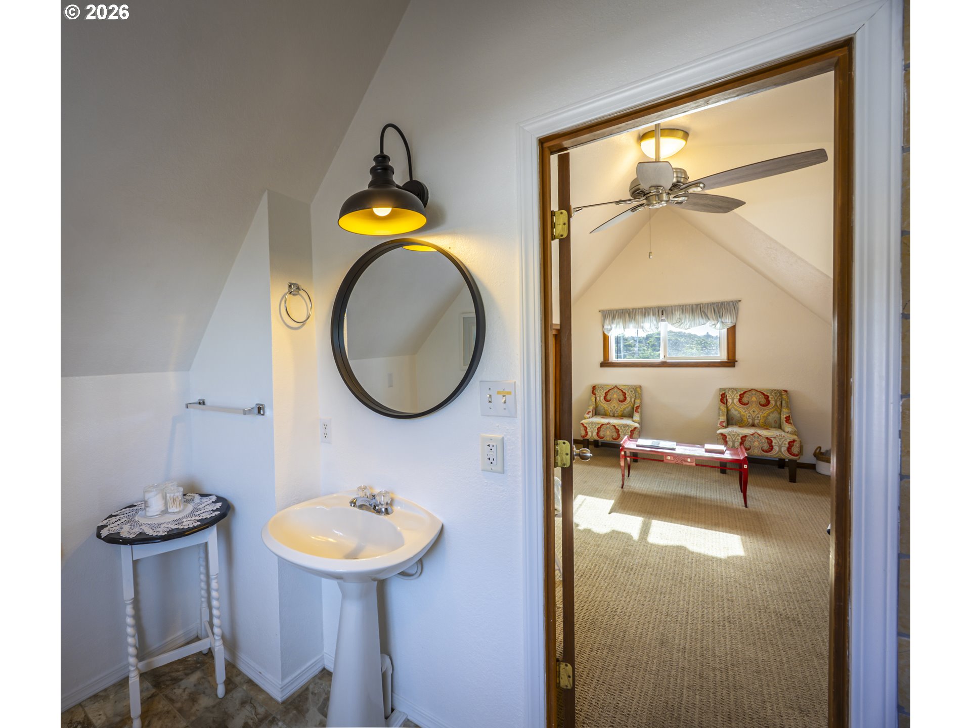 88426 2nd Avenue Florence, OR 97439 - Photo 15 of 45 a bathroom with a toilet a sink and a mirror