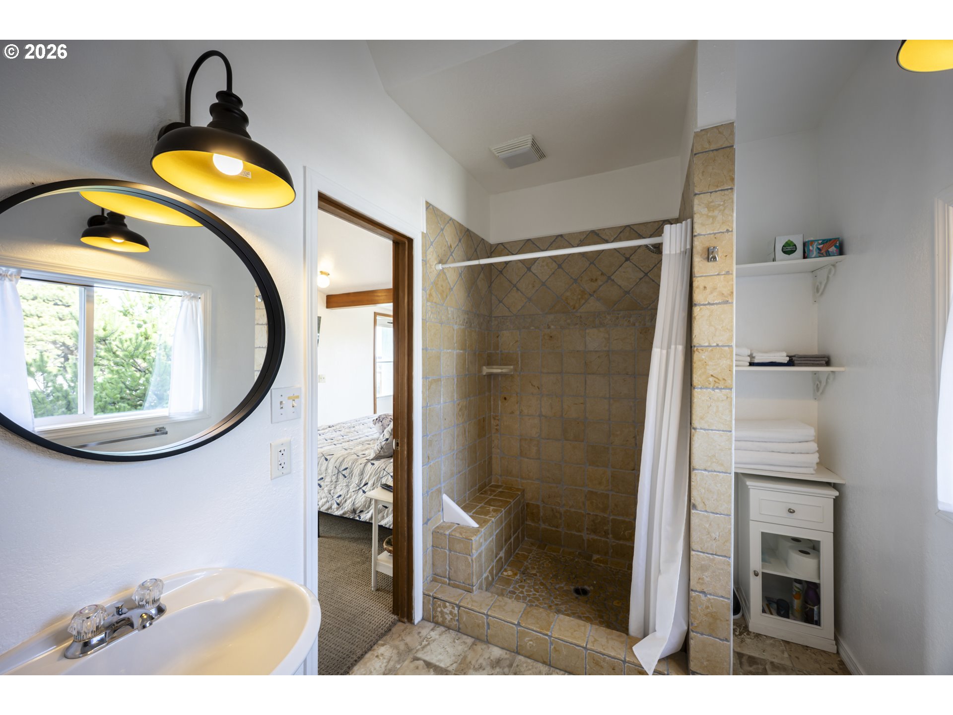 88426 2nd Avenue Florence, OR 97439 - Photo 16 of 45 a bathroom with a toilet sink and mirror
