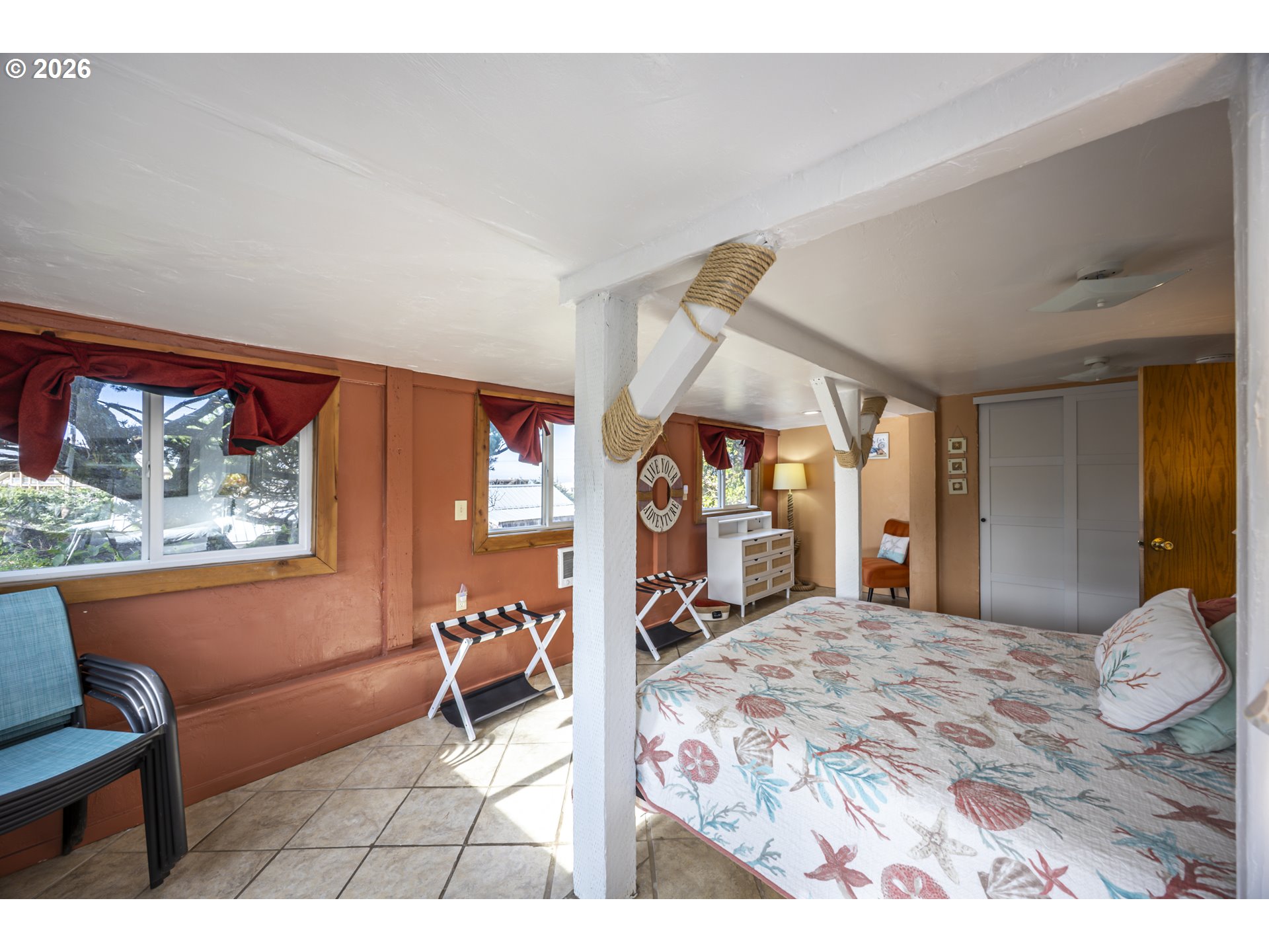 88426 2nd Avenue Florence, OR 97439 - Photo 24 of 45 a bedroom with a large bed and a window