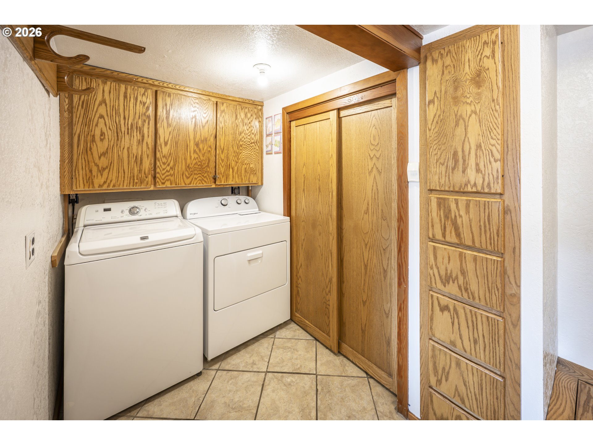 88426 2nd Avenue Florence, OR 97439 - Photo 28 of 45 a view of storage and utility room with washer and dryer