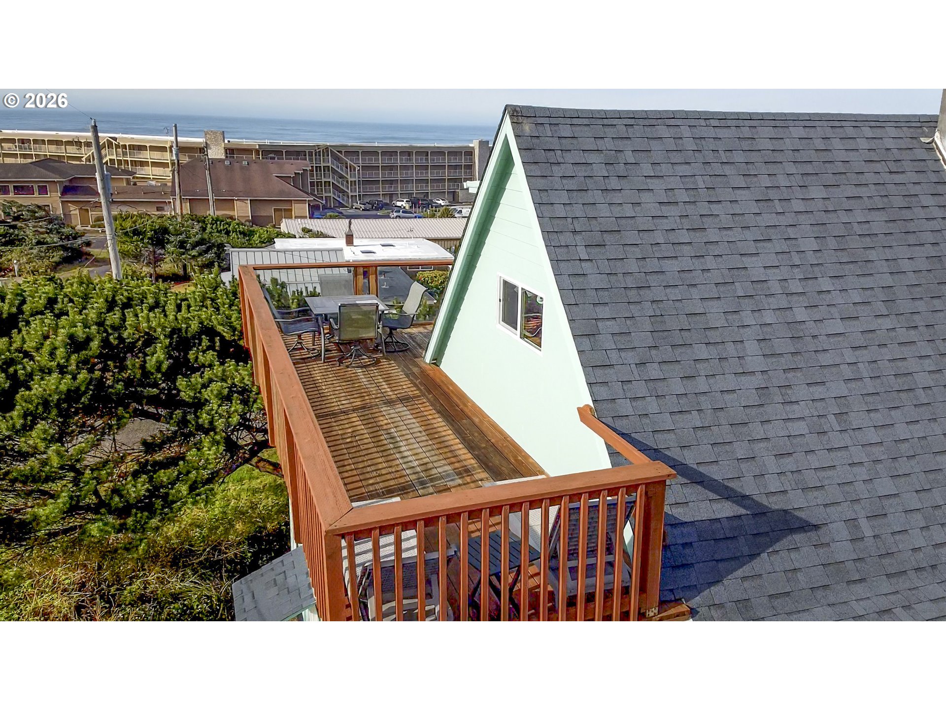 88426 2nd Avenue Florence, OR 97439 - Photo 32 of 45 a view of a balcony with wooden benches