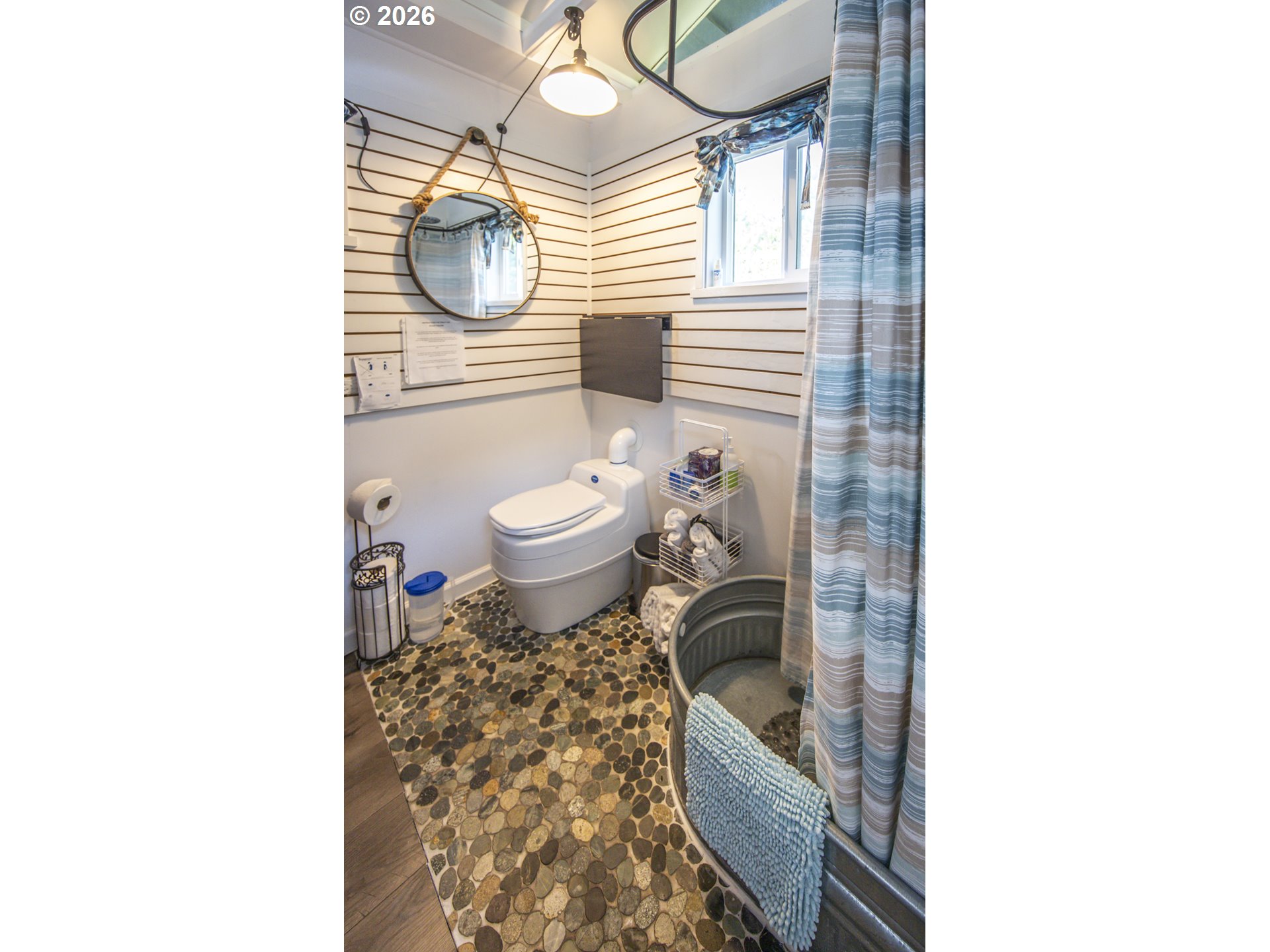 88426 2nd Avenue Florence, OR 97439 - Photo 39 of 45 a bathroom with a toilet and a shower