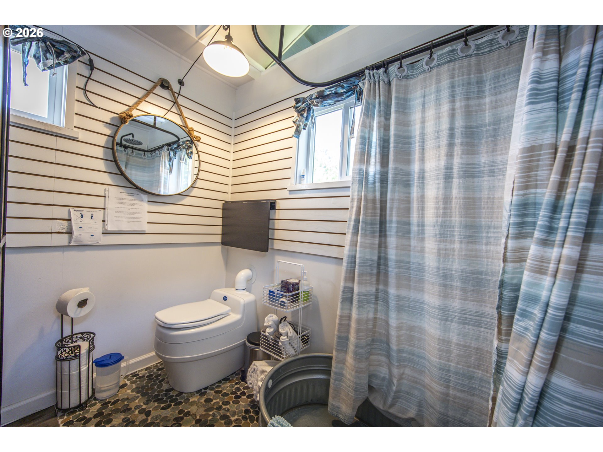 88426 2nd Avenue Florence, OR 97439 - Photo 40 of 45 a bathroom with a toilet a sink and a mirror
