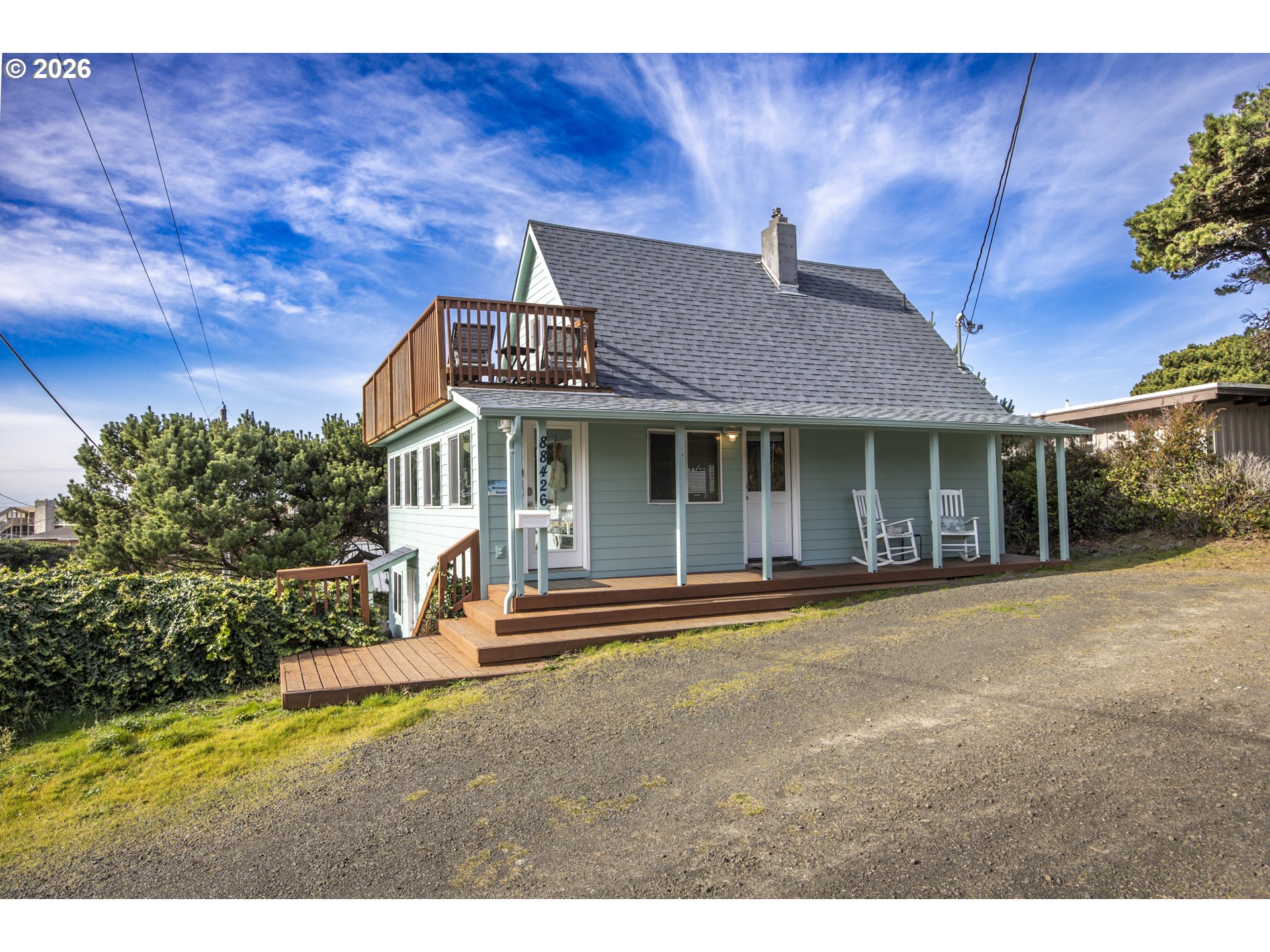88426 2nd Avenue Florence, OR 97439 - Photo 4 of 45 a front view of a house with a yard