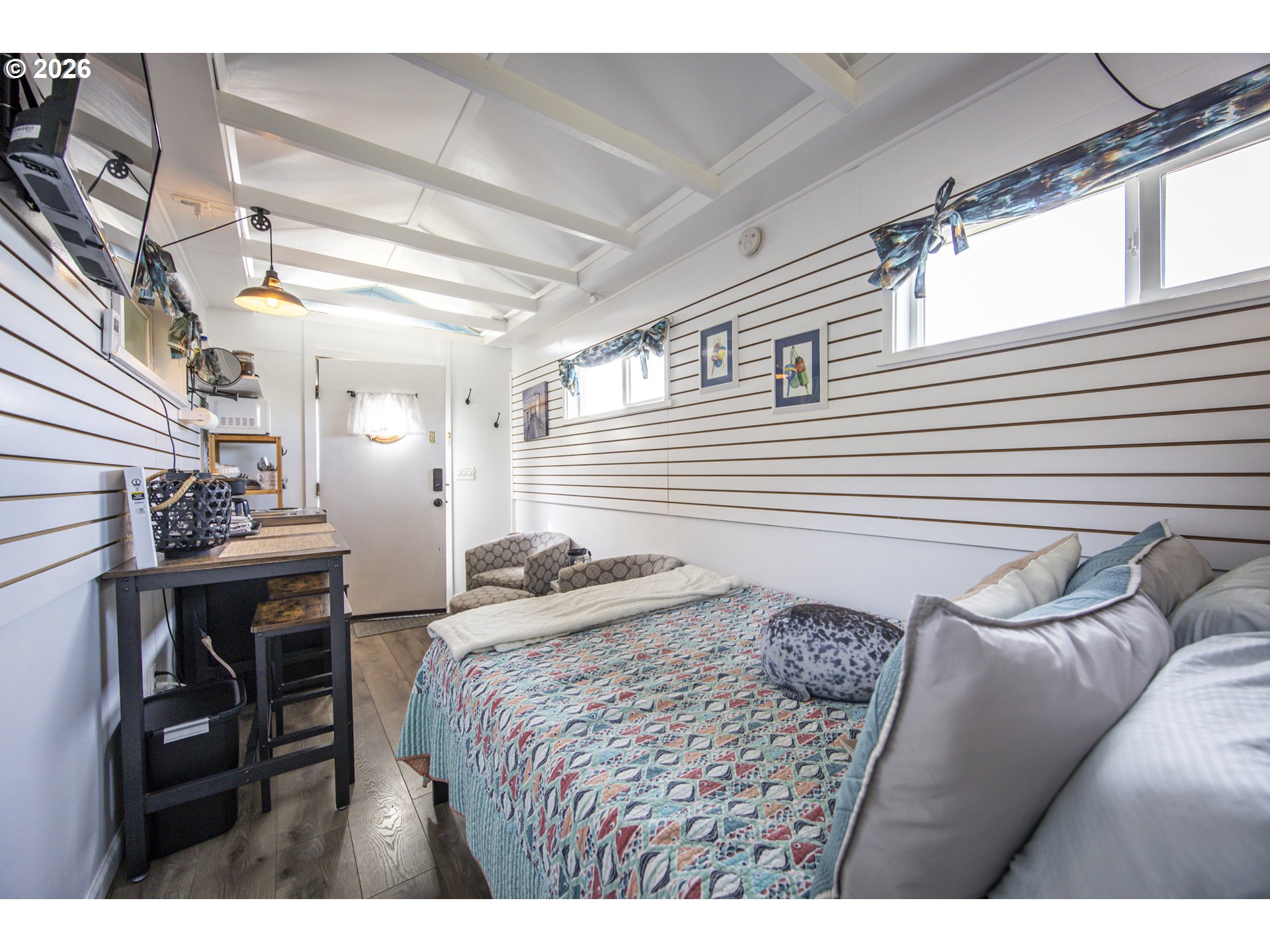 88426 2nd Avenue Florence, OR 97439 - Photo 41 of 45 a bedroom with a bed and a table chair