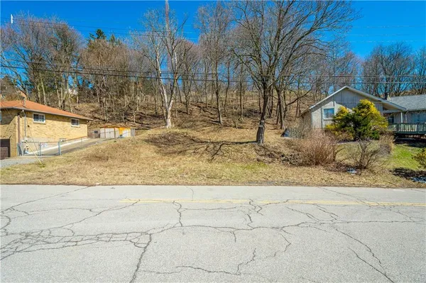 a view of a yard covered with snow in the background