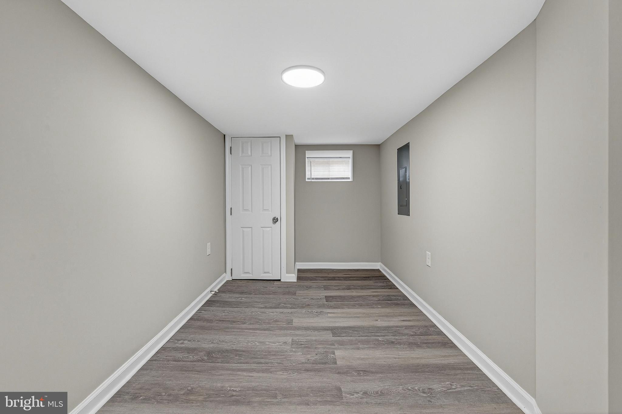 328 South Payson Street Baltimore, MD 21223 - Photo 14 of 27 a view of an empty room and wooden floor