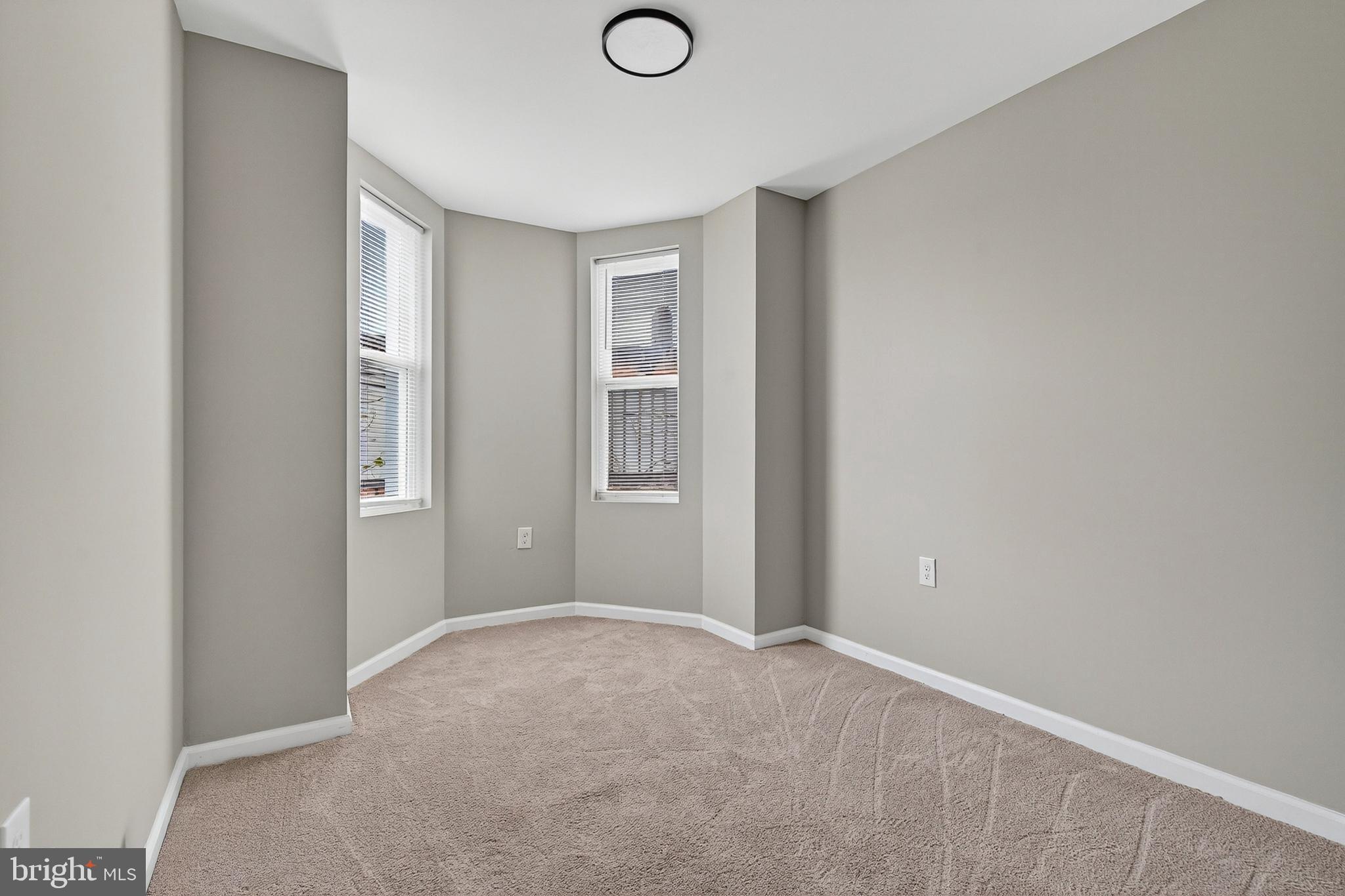 328 South Payson Street Baltimore, MD 21223 - Photo 16 of 27 a view of an empty room with closet and a window