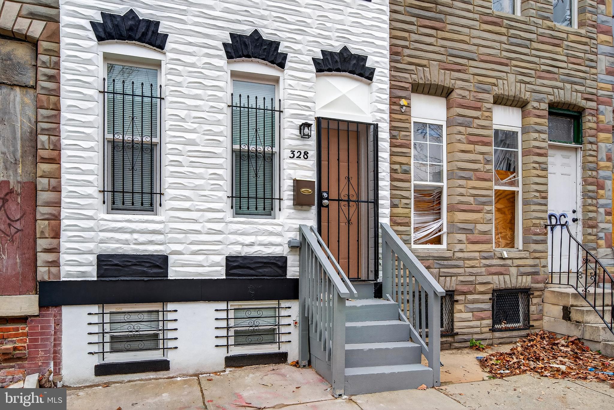 328 South Payson Street Baltimore, MD 21223 - Photo 26 of 27 a front view of a house with a door