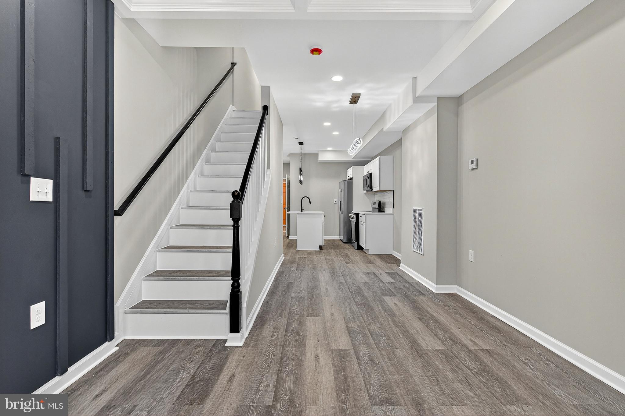 328 South Payson Street Baltimore, MD 21223 - Photo 4 of 27 a view of entryway with wooden floor