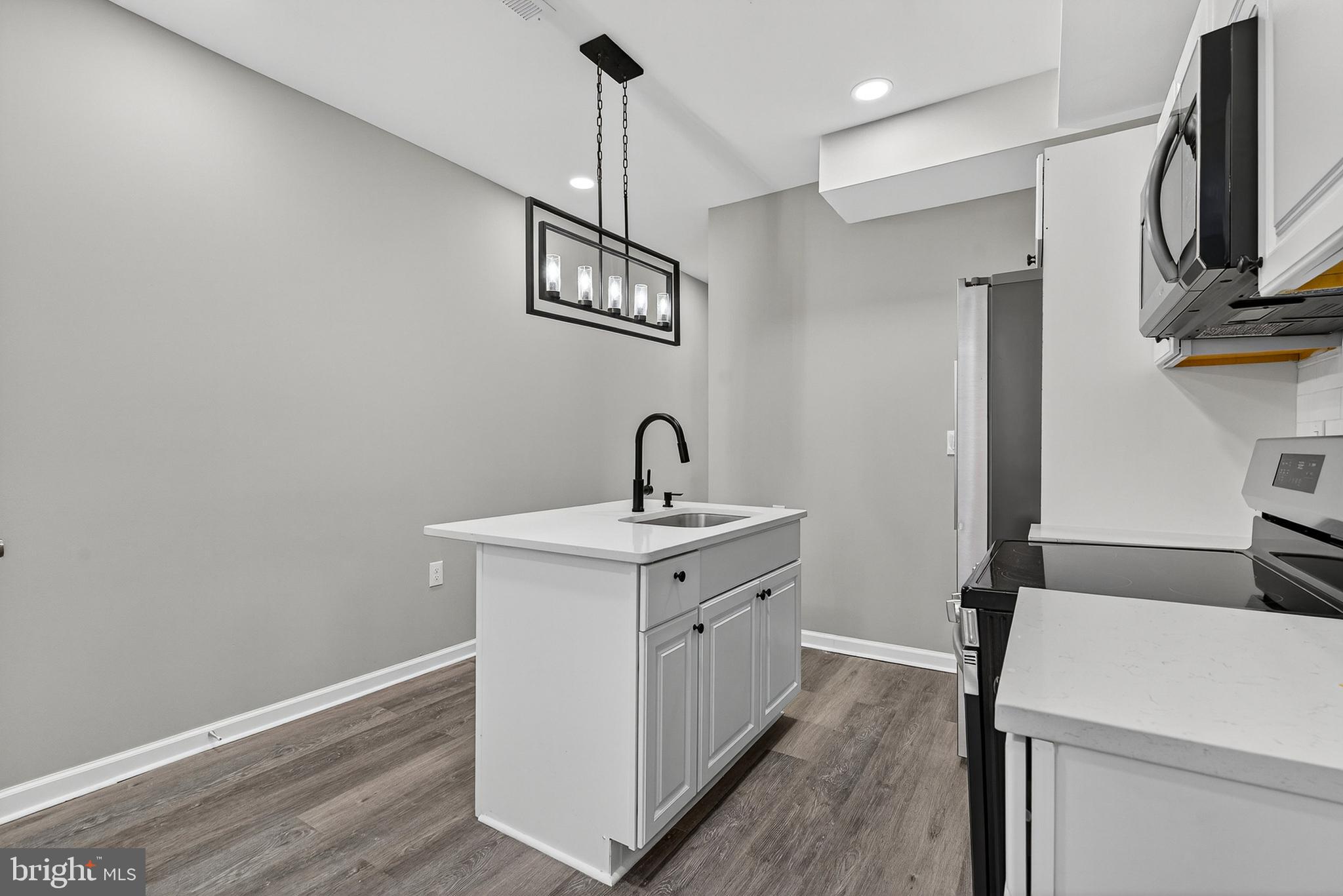 328 South Payson Street Baltimore, MD 21223 - Photo 6 of 27 a view of hallway with washer and dryer