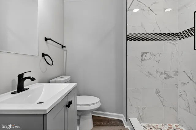 a bathroom with a sink and mirror