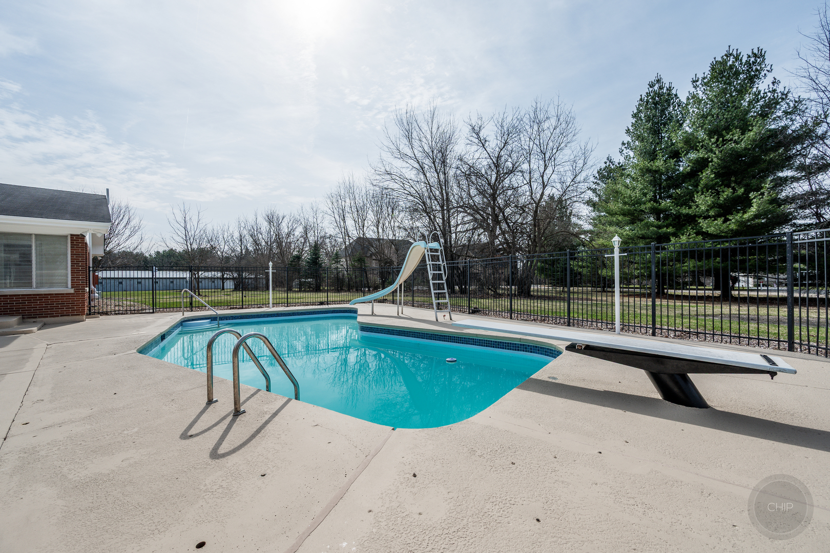 15600 Griswold Springs Road Plano, IL 60545 - Photo 73 of 96 a view of a swimming pool with a slide and bench