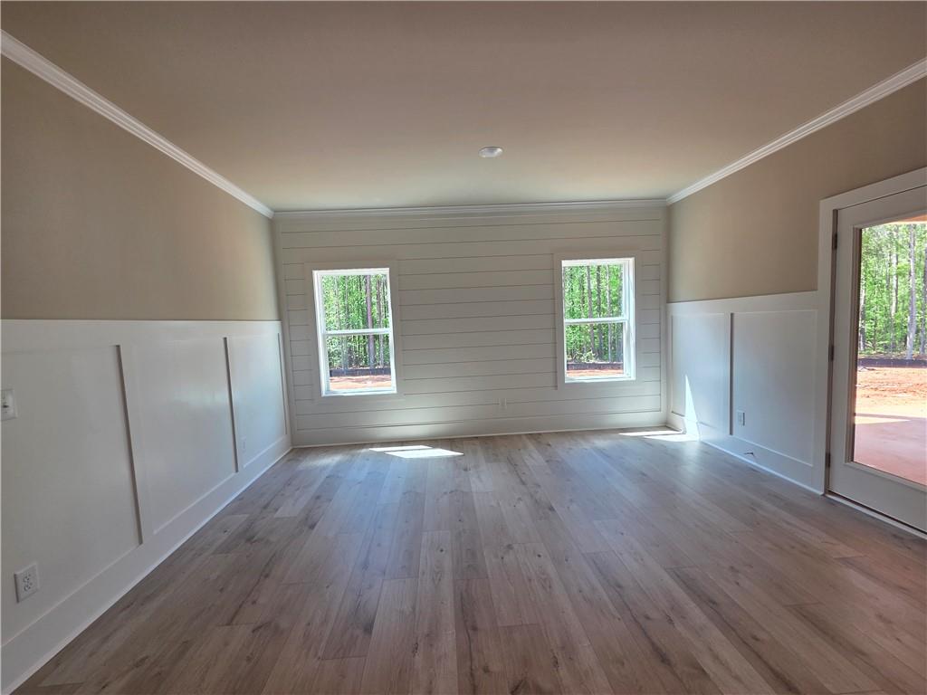293 Meadows Drive Bethlehem, GA 30620 - Photo 17 of 34 an empty room with wooden floor and windows